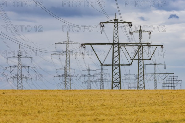 Many high-voltage power lines and lattice towers in the district of Ludwigsburg near Besigheim, Baden-Württemberg, Germany