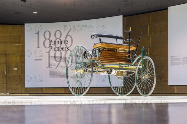 Benz Patent Motor Car from 1886 - the world's first petrol car. The Mercedes-Benz Museum in Stuttgart presents a journey through the automotive history of the global corporation. The history of the Mercedes star begins with the first automobile in 1886. 160 vehicles are on display. Stuttgart, Baden-Württemberg, Germany