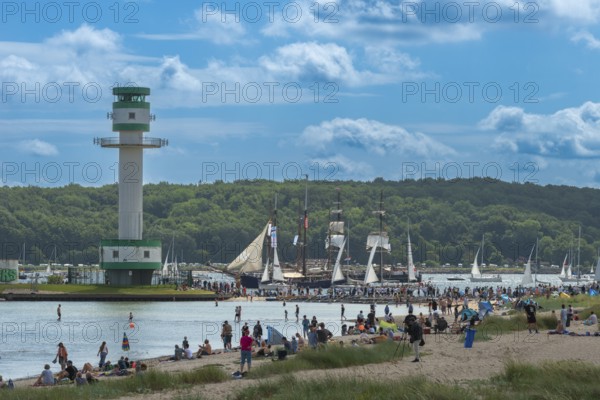 Windjammer Parade 2025 on the Kiel Fjord at the end of Kiel Week, tall ships, three-masters, spectators, Falkensteiner Strandleben, lighthouse, summer weather, sunshine, forest, Kiel, Schleswig-Holstein, Germany