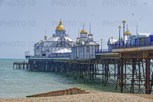 Beach and pier in Eastbourne, seaside resort on the English Channel, in the county of East Sussex, England, United Kingdom of Great Britain