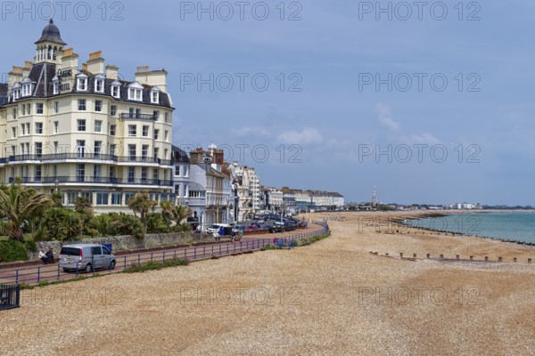 Beach and building on the seafront in Eastbourne, seaside resort on the English Channel, in the county of East Sussex, England, United Kingdom of Great Britain