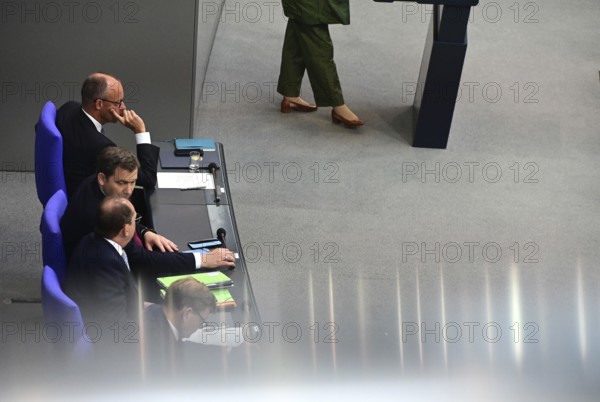 Federal Chancellor Friedrich Merz (CDU) and parts of his cabinet sit on the government bench, whilec, co-chair of the Greens parliamentary group, responds to the Federal Chancellor's government statement