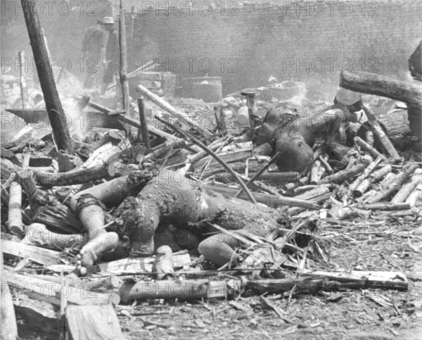 War victims, civilians. Presumably Shangai or in the immediate vicinity. Second World War in Asia. The Second Sino-Japanese War began on 7 July 1937 and lasted until 9 September 1945. It was an all-out invasion of China by the Japanese