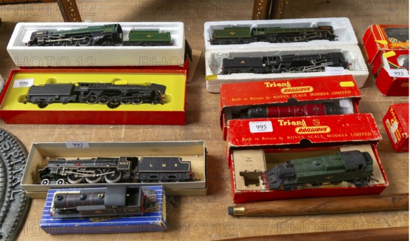 Model railway toy train set items on display for sale at auction room, UK