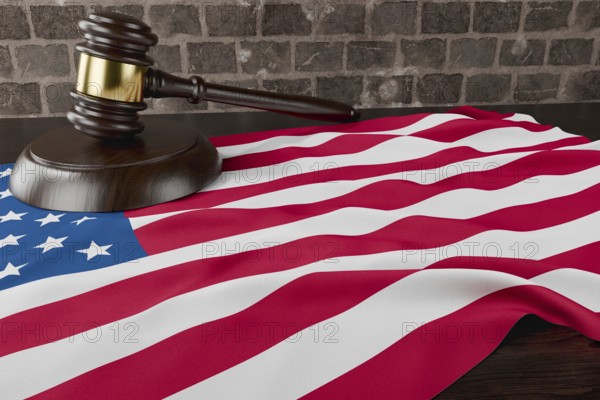 American flag and wooden gavel resting on desk