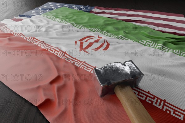 Large hammer resting on american and Iranian flags