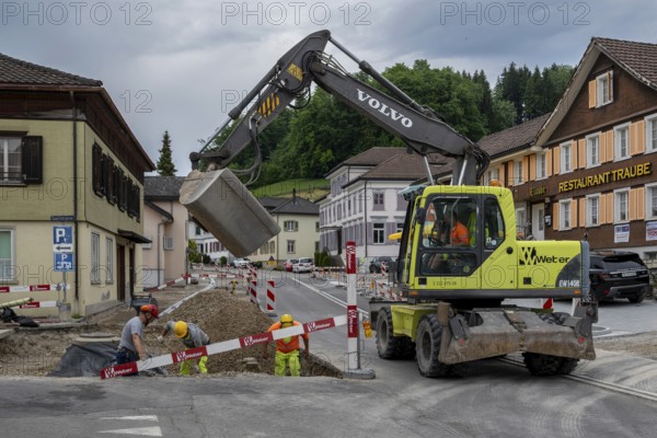Road construction site mobile excavator, Gähwil, St. Gallen, Switzerland