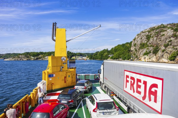 Cars and lorries on a car ferry operating as a floating road, near Lysekil, Bohuslän, Västra Götalands län, Sweden, Scandinavia, for editorial use only