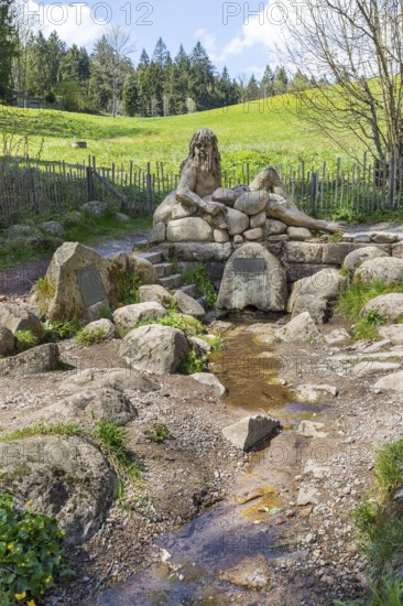 Figure of the river god Danuvius by sculptor Wolfgang Eckert at the source of the Breg, source of the Danube in Furtwangen in the Black Forest, Baden-Württemberg, Germany