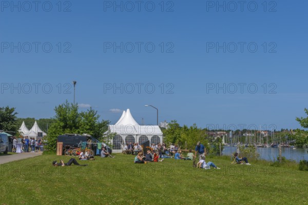 Waterkant Festival 25 in front of Kiel Week 2025 on the MGF 5 site on the Kiel Fjord, annual meeting place for founders of start-up companies with innovative ideas for new technologies, ecology and society, workshops and exhibitions, break and discussion in the open air, Kiel Holtenau, Schleswig-Holstein, Germany