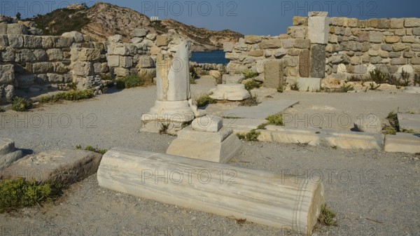 Ancient marble ruins with remains of columns and walls in an archaeological site, Agios Stefanos Beach, Agios Stefanos Basilica, Agios Nikolaos Chapel, Kastri Island, Kos, Dodecanese, Greek Islands, Greece