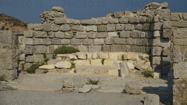 Stone ruins with ancient walls standing under the sun, Agios Stefanos Beach, Agios Stefanos Basilica, Agios Nikolaos Chapel, Kastri Island, Kos, Dodecanese, Greek Islands, Greece