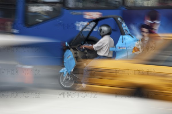 Man riding a motorcycle, Riding at high speed, Photo with motion blur, City of Quito, Pichincha province, Ecuador, South America