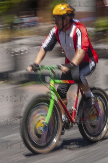 Man riding a bicycle, Photo with motion blur, City of Quito, Pichincha province, Ecuador, South America