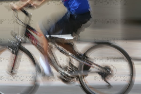 Man riding a bicycle, Photo with motion blur, City of Quito, Pichincha province, Ecuador, South America