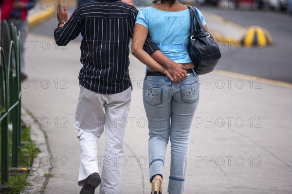 Couple walking in street, Hand in hand, City of Quito, Pichincha province, Ecuador, South America