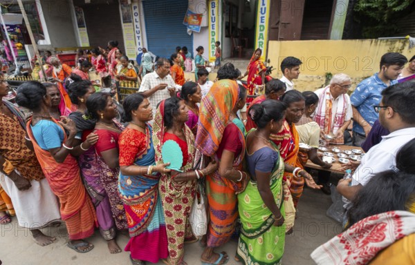 Devotees throng to have food as they arrives to visit Kamakhya Temple during Ambubachi Mela, in Guwahati, India on June 22, 2025. The Ambubachi Mela is one of the most spiritually significant and culturally unique festivals in India