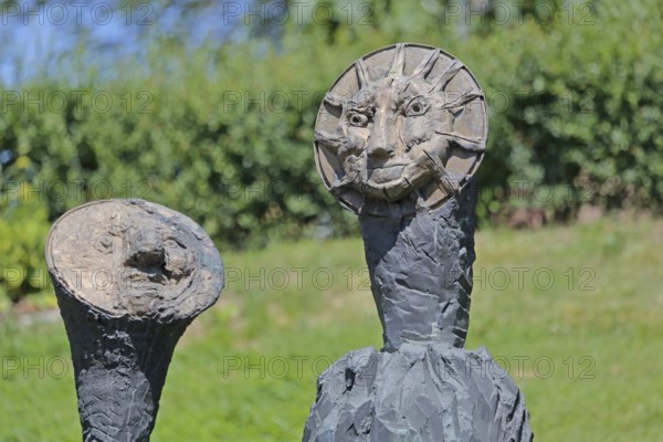 Sculpture Sun and Moon by Markus Lüpertz 2017, modern art, bronze sculpture, two faces, moon face, symbol, figures, astronomy, detail, Blumenhof, Pforzheim, Northern Black Forest, Black Forest, Baden-Württemberg, Germany