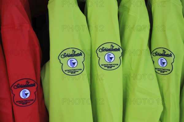 Weather jackets from the manufacturer Schietwetter in an outdoor shop in Husum, Schleswig Holstein, Germany (for editorial use only)