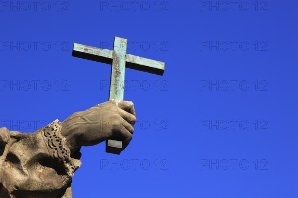 Detail of hand with cross, St John of Nepomuk on the Old Main Bridge, Würzburg, Lower Franconia, Bavaria, Germany