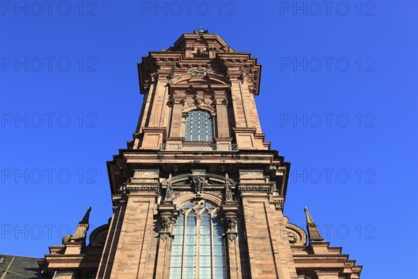 Tower of the new church. Today the building is used as an assembly hall and banqueting hall of the Julius Maximilian University, Würzburg, Lower Franconia, Bavaria, Germany