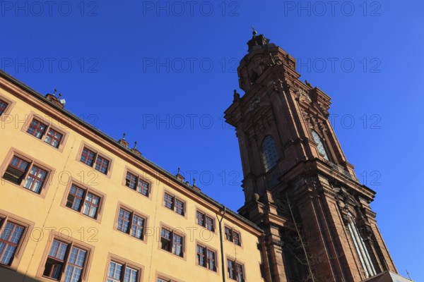 Building of the old university of Julius Echter, tower of the new church. Today the building is used as the assembly and ceremonial hall of the Julius Maximilian University, Würzburg, Lower Franconia, Bavaria, Germany