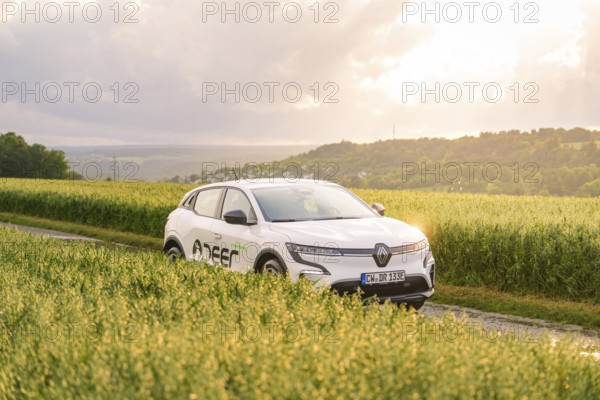 Renault vehicle standing in the middle of a field at sunset in the background, Deer E- CarSharing, Renault Megane electric car, Calw, Black Forest, Germany