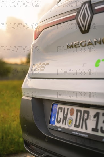 Rear view of a Renault with licence plate and sunlight in the background, Deer E- CarSharing, Renault Megane electric car, Calw, Black Forest, Germany