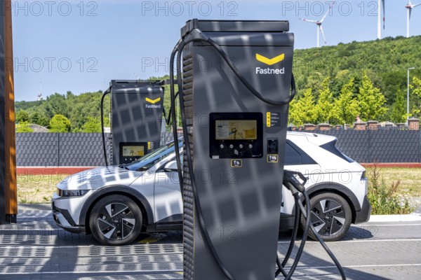 Electric charging station on the site of the former Lohberg colliery in Dinslaken, operated by Fastned, uses electricity from wind power and solar energy, fast-charging columns, with its own solar roof, Lohberg, North Rhine-Westphalia, Germany