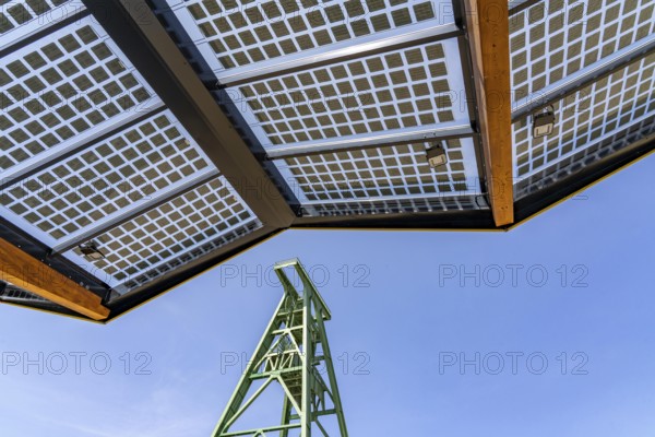 Electric charging station on the site of the former Lohberg colliery in Dinslaken, operated by Fastned, uses electricity from wind power and solar energy, fast-charging columns, with its own solar roof, Lohberg colliery headframe, North Rhine-Westphalia, Germany
