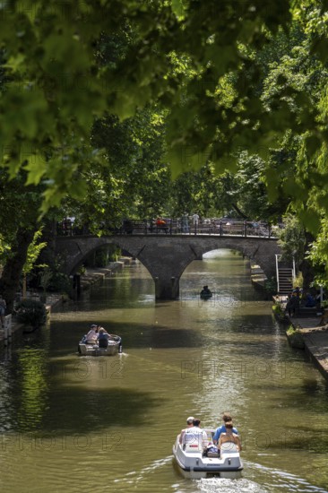 The old town centre of Utrecht, Oudegracht, around 2 km long with many old houses, shops, restaurants directly on the canal, many bridges, boat traffic of all kinds, Netherlands