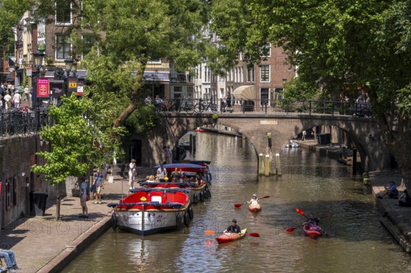 The old town centre of Utrecht, Oudegracht, around 2 km long with many old houses, shops, restaurants directly on the canal, many bridges, boat traffic of all kinds, Netherlands