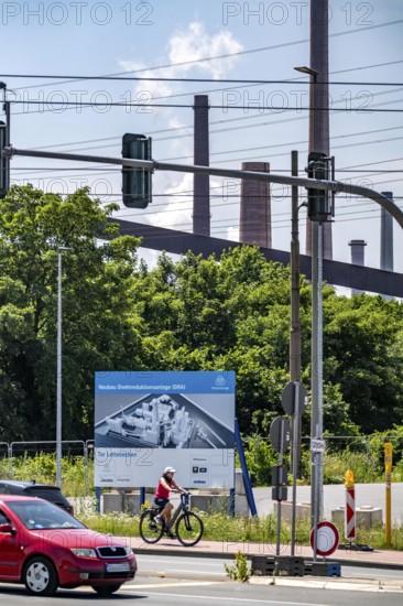Construction site sign for thyssenkrupp Steel's first direct reduction plant, the climate-neutral steel production project, at the existing steelworks in Duisburg-Farn, pig iron production without a conventional blast furnace but using hydrogen, due to go into operation by the end of 2027, North Rhine-Westphalia, Germany