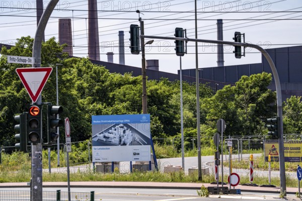 Construction site sign for thyssenkrupp Steel's first direct reduction plant, the climate-neutral steel production project, at the existing steelworks in Duisburg-Farn, pig iron production without a conventional blast furnace but using hydrogen, due to go into operation by the end of 2027, North Rhine-Westphalia, Germany