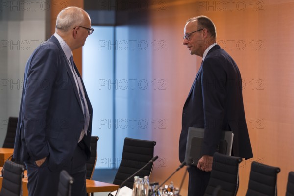Andreas Bovenschulte (SPD, Mayor of Bremen and President of the Bremen Senate) and Friedrich Merz (CDU, Federal Chancellor) in front of the meeting between Federal Chancellor Friedrich Merz and the heads of government of the federal states in the International Conference Hall of the Federal Chancellery, Berlin, 18 June 2025