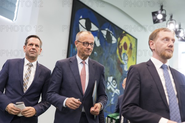 Olaf Lies (SPD, Minister President of Lower Saxony), Friedrich Merz (CDU, Federal Chancellor) and Michael Kretschmer (CDU, Minister President of the Free State of Saxony) after a press conference on the consultation between Federal Chancellor Friedrich Merz and the heads of government of the federal states at the Federal Chancellery, Berlin, 18 June 2025