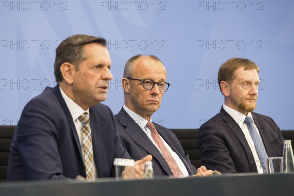 Olaf Lies (SPD, Minister President of Lower Saxony), Federal Chancellor Merz (CDU, Federal Chancellor) and Michael Kretschmer (CDU, Minister President of the Free State of Saxony) during a press conference after the consultation between Federal Chancellor Friedrich Merz and the heads of government of the federal states in the Federal Chancellery, Berlin, 18 June 2025
