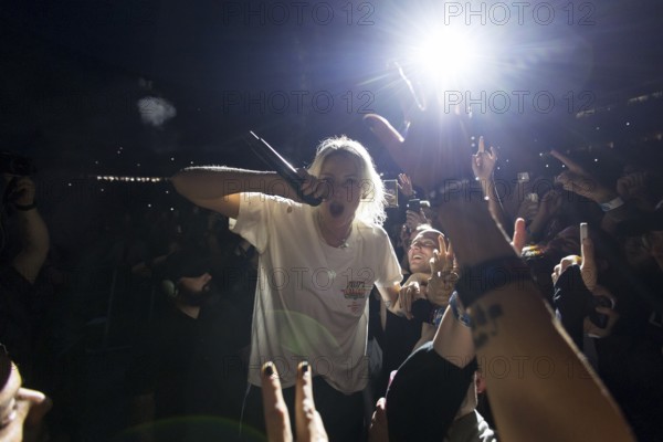 Emily Armstrong, lead singer of Linkin Park in the photo pit between the audience live on From Zero World Tour 2025 at the Olympiastadion Berlin on 18 June 2025