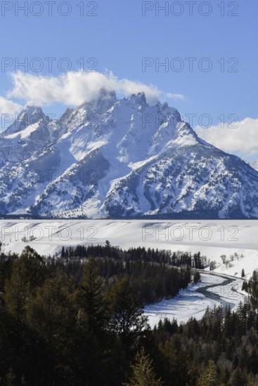 View over the Snake River... Teton Range (Rocky Mountains) in winter with snow, down in the valley the river meanders like a snake, behind it the high mountains rise steeply, famous landscape in North America, Grand Teton area, Wyoming, North America, United States of America