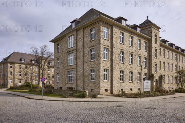 Tax office, sandstone building, bare wintry trees, diffuse light, slightly sunny, cloudy, street Tessenowstraße, Magdeburg, state capital, independent city, Saxony-Anhalt, Germany