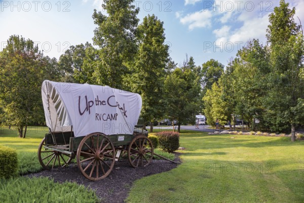 Covered wagon used for sign at the Up the Creek RV Camp campground in Pigeon Forge, Tennessee