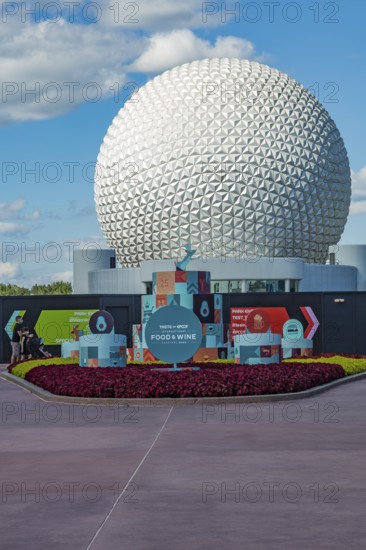 Sign in front of the Spaceship Earth geodesic sphere near entrance to the Food and Wine Festival in Epcot at Walt Disney World in Orlando, Florida