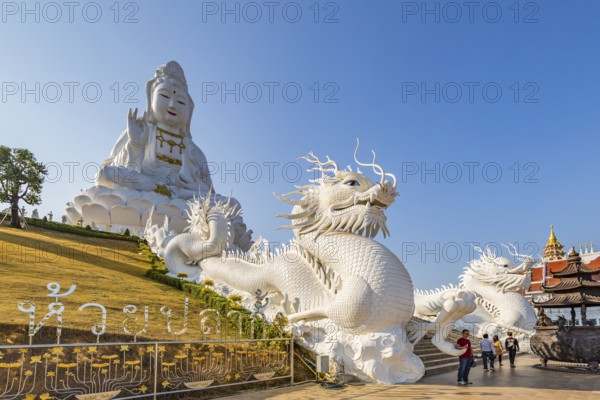 Chinese dragons line the steps up to the Guan Yin (Goddess of Mercy) statue at Wat Huay Pla Kang Temple in Chiang Rai province of Northern Thailand