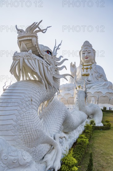 Chinese dragons line the steps up to the Guan Yin (Goddess of Mercy) statue at Wat Huay Pla Kang Temple in Chiang Rai province of Northern Thailand