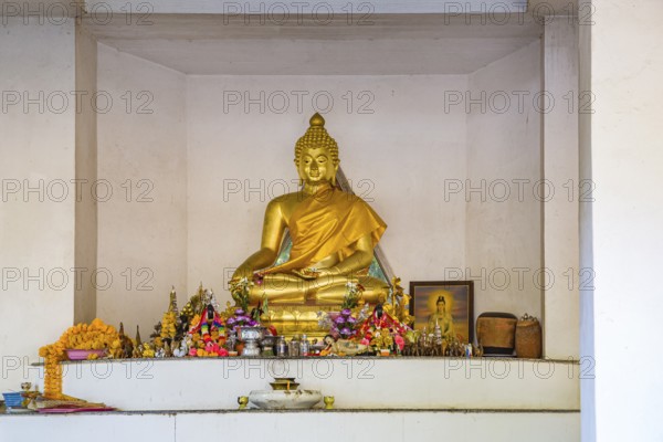 Buddah shrine at the Hall of Buddah Image on the campus of CRRU Shiangrai Rajabhat University in Chiang Rai, Thailand