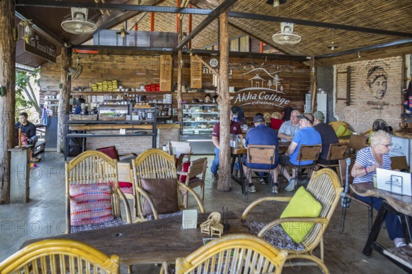 American missionary volunteers eating at the Akha Cottage restaurant and coffee shop in Chiang Rai, Thailand