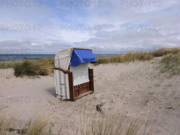 Beach chair dunes Strandwarder in front of Fehmarn bridge Heiligenhafen Baltic Sea Germany