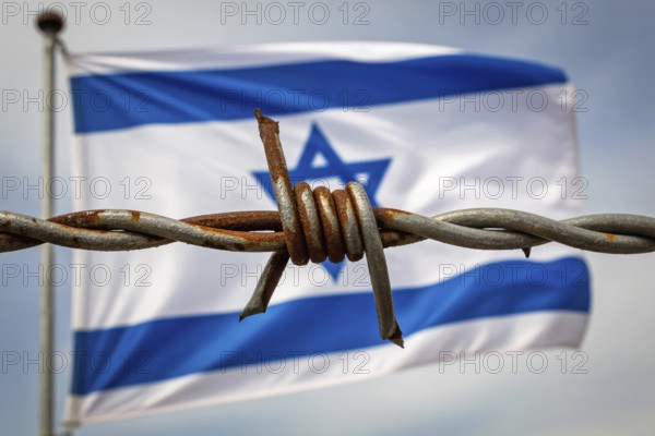 Rusty barbed wire in sharp focus with waving Israeli flag in blurred background. Symbol of conflict, war, and national tension. Generative AI, AI generated