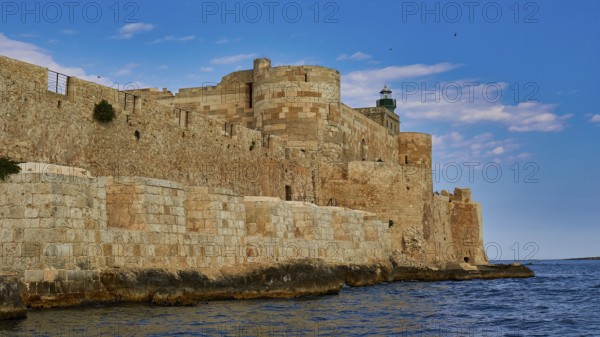 Castello Maniace, Maniace sea fortress, old castle by the sea under a blue sky, surrounded by stone walls, boat trip around the island of Ortigia, Isola di Ortigia, Syracuse, Sicily, Italy