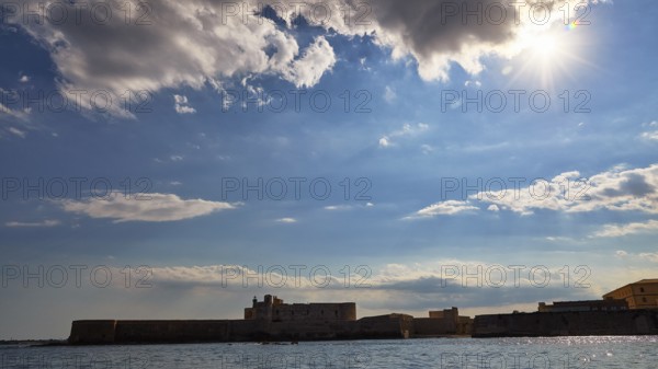 Castello Maniace, sea fortress Maniace, coastal fortress in sunlight under a cloudy sky, boat trip around the island of Ortigia, Isola di Ortigia, Syracuse, Sicily, Italy